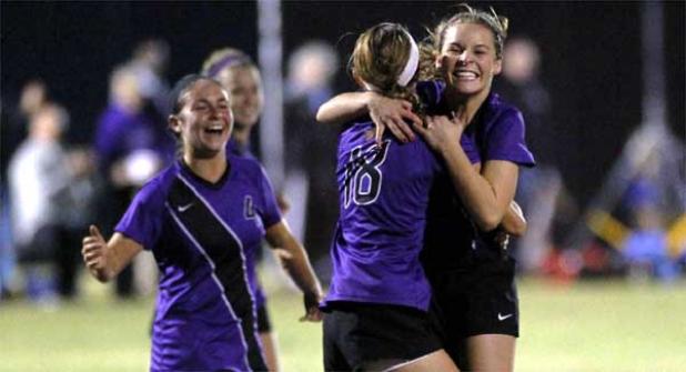 With teammate Lexie Hall (18), Fletcher High’s Kendall Sambito, right, celebrates her goal against Bolles in the semifinal round of the Northeast Florida Showcase tournament Dec. 9 at Veterans Park. Sambito scored both goals in the Senators’ 2-1 victory over Atlantic Coast in last Friday’s District 3-4A championship game. Fletcher hosts Nease tonight at 7 p.m. in the opening round of the state’s Class 4A girls soccer playoffs. (photo by Rob DeAngelo)
