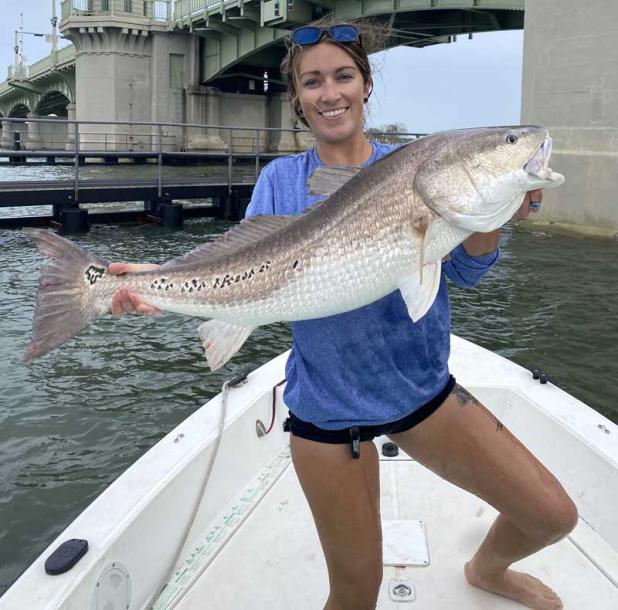 St. Augustine angler Kellie Douglas with a beautiful multi-spotted bull redfish. (photo submitted)