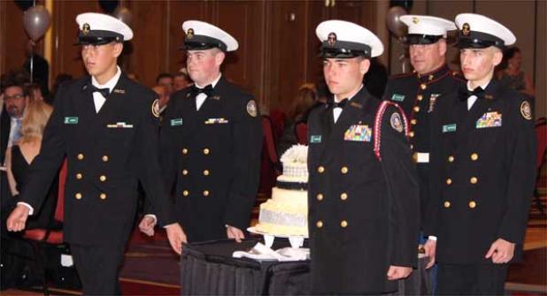 NJROTC cadets (left to right) Chris Gilmer, Chris McDonough, Alex DeRoven and Preston Whitman formally present the cake under the direction of Gunnery Sgt. Duane Hanson during the 23rd annual Navy Ball. (photo submitted)