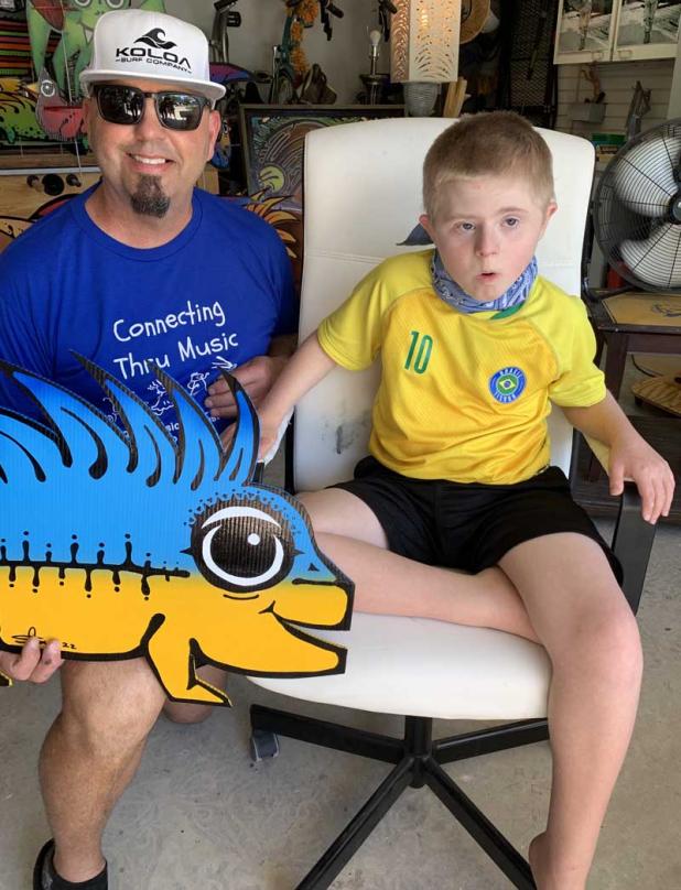 Scotie Cousin with Dante Demuth, who inspired his mom to found CTM.