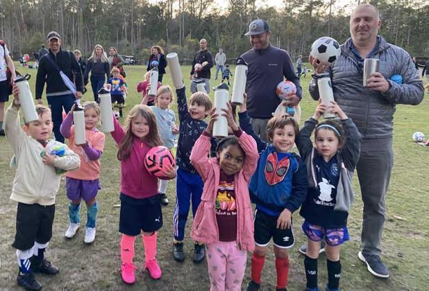 Local teams pose with their reusable water bottles that were donated by local sponsors as part of the Beaches Go Green Reusable Bottles for Sports program. (photos submitted)