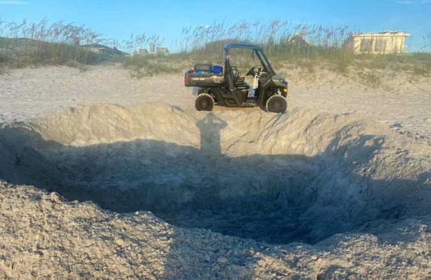 This hole, about 14-foot-by-13-foot and five-foot-deep, was discovered on Jacksonville Beach. (photo courtesy of Beaches Sea Turtle Patrol)