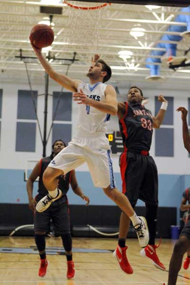 Ponte Vedra High guard J.D. Pirris (1) drives to the basket for two of his game-high 24 points against Alachua Santa Fe in the regional semifinal round of the playoffs Feb. 16 at the Shark Tank. PV won 59-54 to advance to Feb. 19’s Regional 2-5A final. (photo by Rob DeAngelo)