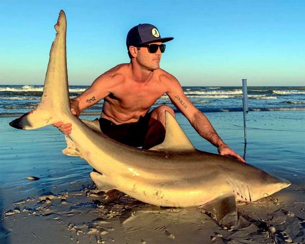 Angler Will Vogt with a blacktop shark caught off Jax Beach. (photo submitted)
