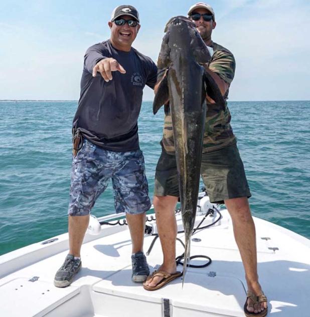 Capt. Chris Herrera and Justin Quintal with an impressive cobia. (photo submitted)