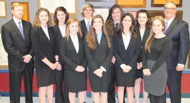 Fletcher High’s 2016 law team features (from left, front row) senior Emily Shapiro, junior Kaylee Hoffman, senior Marissa Abry and volunteer coach Katie Shapiro. Back row from left: attorney/coach Jay Howell, senior Devon Roddel, attorney/coach Amber Rumancik, freshman Cory Gann, senior Luke Kasbarian, senior Sarah McWilliams and teacher/sponsor Bruce Wouters. (photo by Johnny Woodhouse)