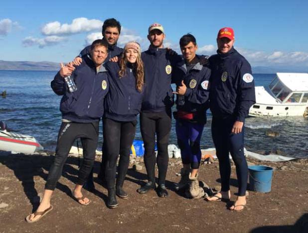 Jacksonville Beach Ocean Rescue members Nicki Emerson (second from left) and Vasili Pleqi (behind her) with other international lifeguards in Lesvos, Greece. The lifeguards have rescued more than 600 refugees since Jan. 2. (photo submitted)