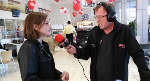 Nease NJROTC cadet Michaela Heinrich conducts a live radio interview on WSOS 99.5 FM after being named the St. Johns County Character Counts Student of the Month. (photo submitted)
