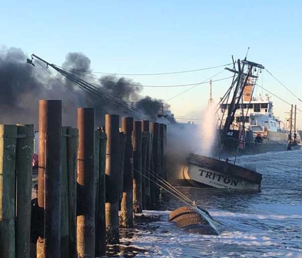The Triton II on fire at the dock in Mayport. (photo submitted)