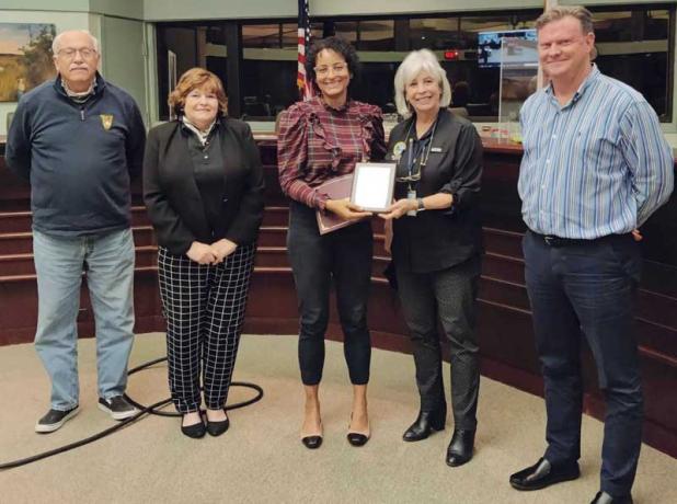 Commissioner Brittany Norris, center, is recognized by, from left, Commissioner Bruce Bole, Commissioner Candace Kelly, Mayor Ellen Glasser and Commissioner Mike Waters. (photo submitted)