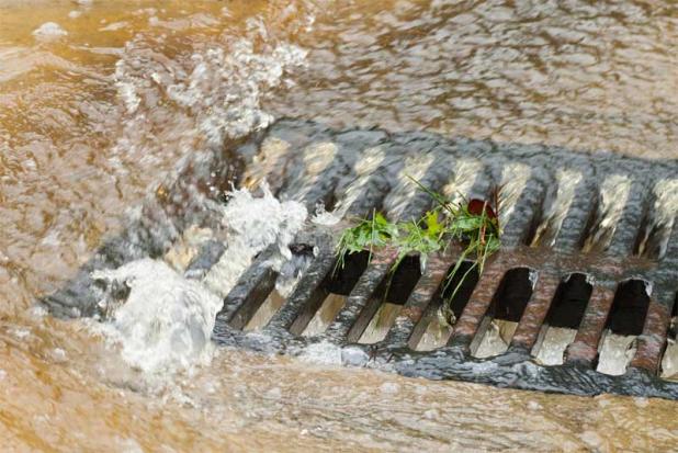 Clear storm drains help prevent local flooding. Prepare for heavy rain by removing debris from storm drains and ditches, and reporting clogged ditches to local governments. (photo submitted)