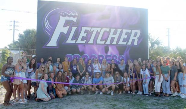 Friends and teammates gather to dedicate ball wall to Maggie Paxton. (photo by Liza Mitchell)