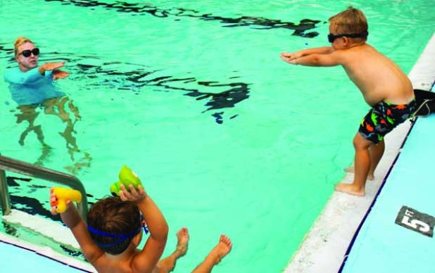 June Williams of the Beaches Aquatic Center gives instruction to two young swimmers. (photo submitted)