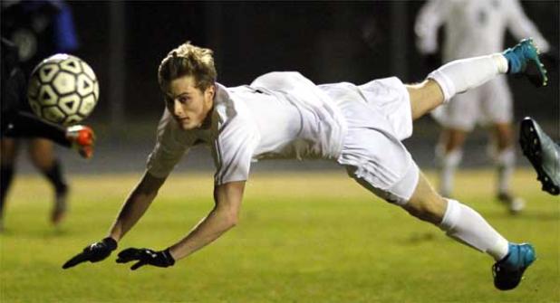 Ponte Vedra High’s Michael Bennett connects on a diving header that sailed just wide of the Matanzas net during first-half action in last Friday night’s District 4-3A championship at Orange Park. (photo by Rob DeAngelo)