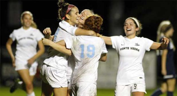 Ponte Vedra High girls soccer players including Piper Dotsikas, Angeline Daly, Abby Miller and Marissa Reinker celebrate Dotsikas’ goal against Gulf Breeze in last Friday night’s regional final playoff game at the Shark Tank. PV earned a 2-0 victory and its sixth consecutive appearance in the state’s final four taking place this week at Melbourne High. (photo by Rob DeAngelo)