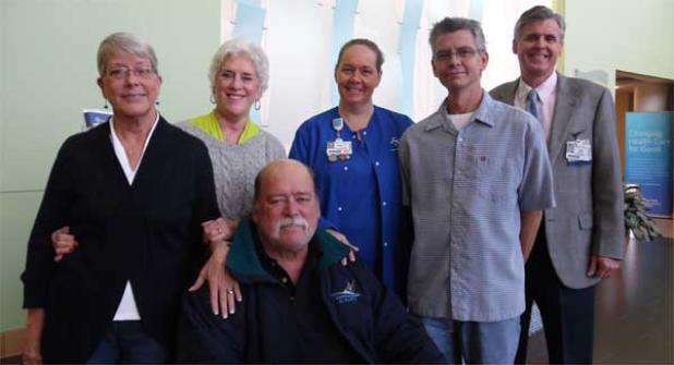 Mildred O’Neal’s siblings (from left) Laura Hyde of Ponte Vedra Beach, Nanci Faulkner, of Neptune Beach and Larry Caldwell (seated) of Ponte Vedra Beach with Baptist Beaches RN April Starling, her husband, Eric, and hospital president Joe Mitrick. (photo submitted)