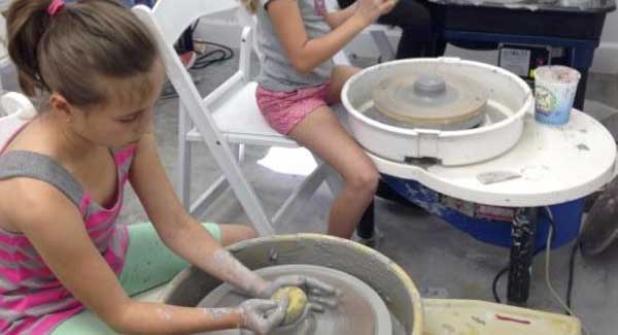 Students use pottery wheels during a previous class at the Cultural Center. (photo submitted)