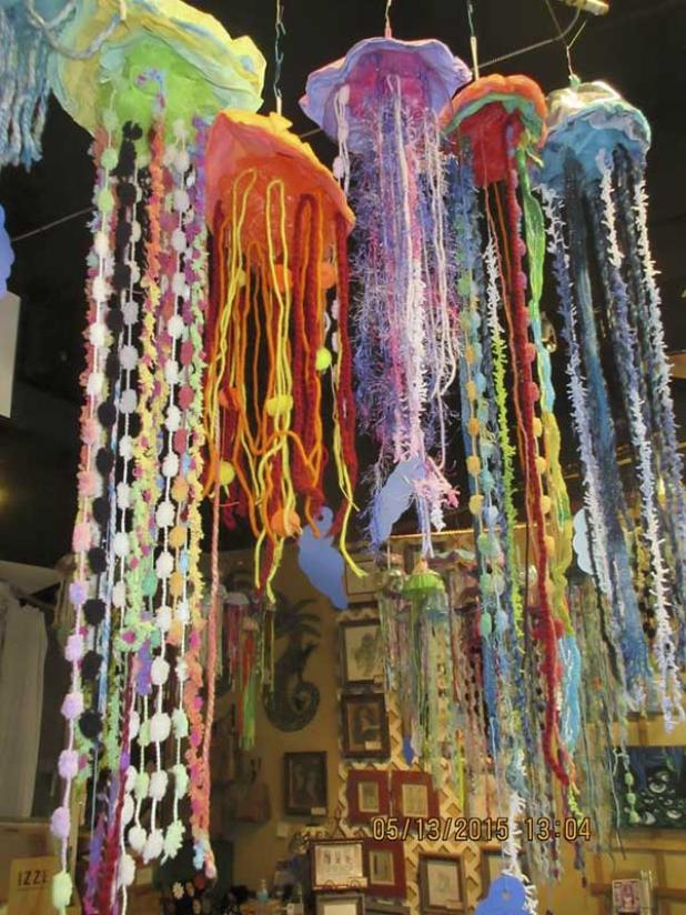 Jellyfish assemblages by sixth grade 3-D art students.
