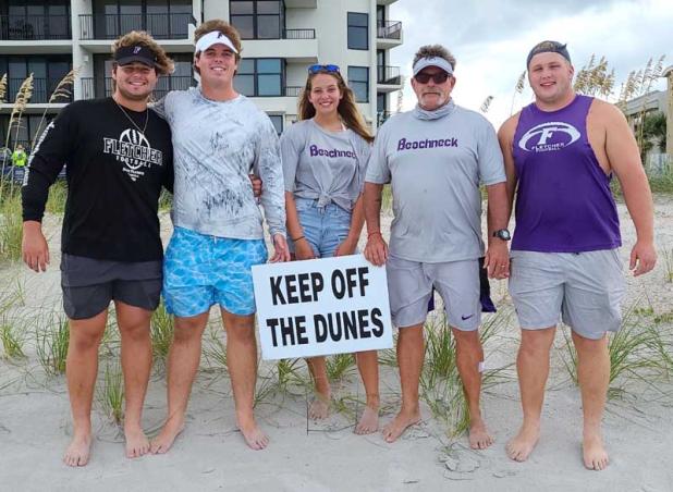 Mike Bartilucci, Colby Smith, Kendall Nordman, Coach Kevin Brown and Chandler Kirton complete the summer 2020 project of planting sea oats. (photo submitted)