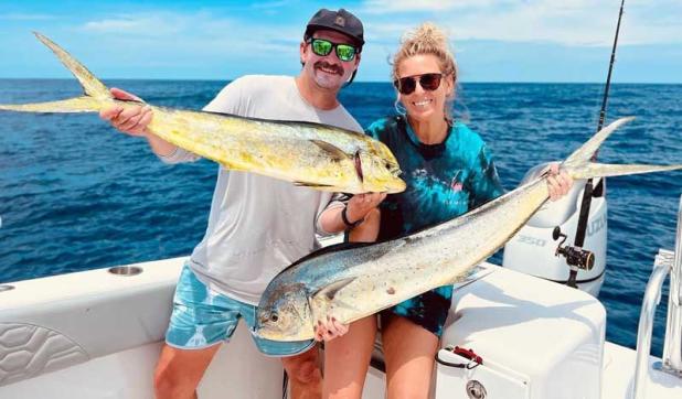 Joe and Stefani Pulido showing off a pair of magi they picked off a weedline last weekend. (photo submitted)