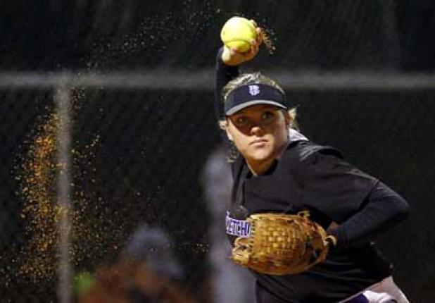 Fletcher High third baseman Claudia Riddle gets set to throw to first base after fielding a ground ball in last Friday night’s game against visiting Atlantic Coast. The Stingrays rallied from an early 2-0 deficit to claim a 4-2 victory in the clash of District 2-8A softball foes. (photo by Rob DeAngelo)
