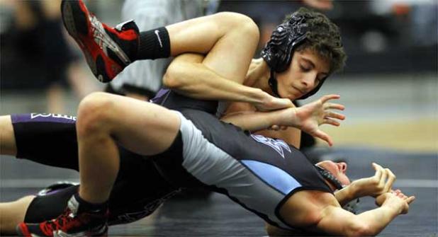 Fletcher High’s Brandon Cuevas gets ready to pin Ponte Vedra High’s Gavin Riccobono at 106 pounds in Feb. 2’s wrestling match. (photo by Rob DeAngelo)