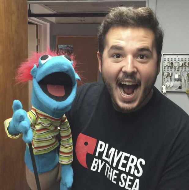 Players by the Sea's Artistic Director Bradley Akers holds one of the custom-made puppets used in "Hand to God." (photo submitted)