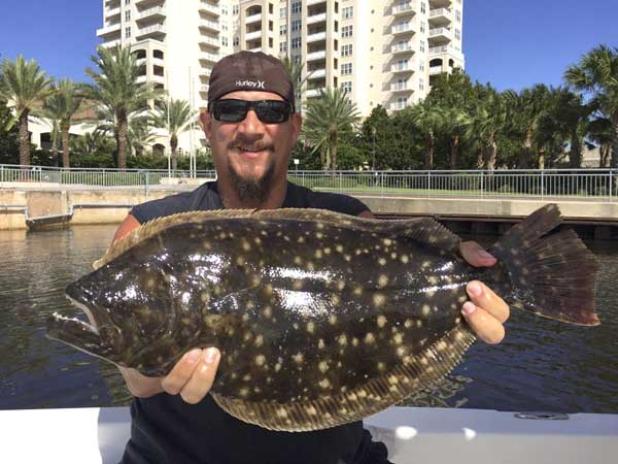 Tim Faughn of Jacksonville Beach with a stud flounder caught fishing downtown. (photo submitted)