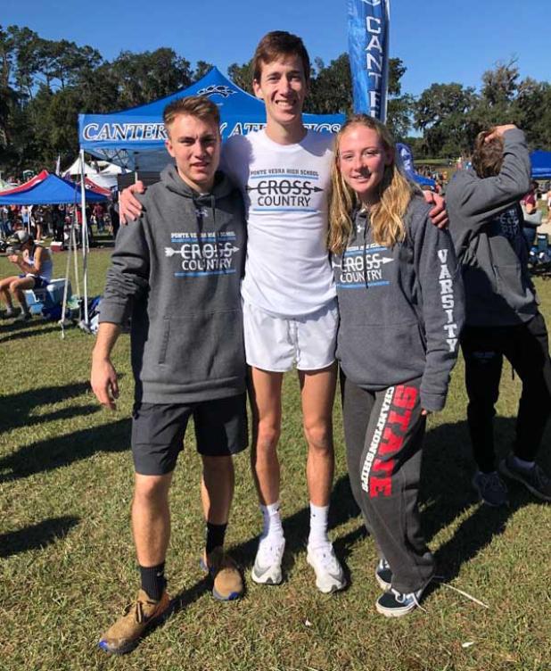 Seniors Cameron Heinz, Kyle Reinheimer and Kaylen McMullin stand together at the 2019 Florida High School Cross Country State Championship. (photo by D. McMullin)