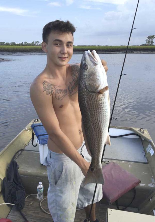 Caleb Gonzales of Neptune Beach caught a beautiful slot red while fishing with Capt. Terry Lee. (photo submitted)