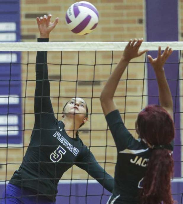 Senators’ Brooke Ruud hits one of her match-high 15 kill shots against Lee. (photo by David Rosenblum)