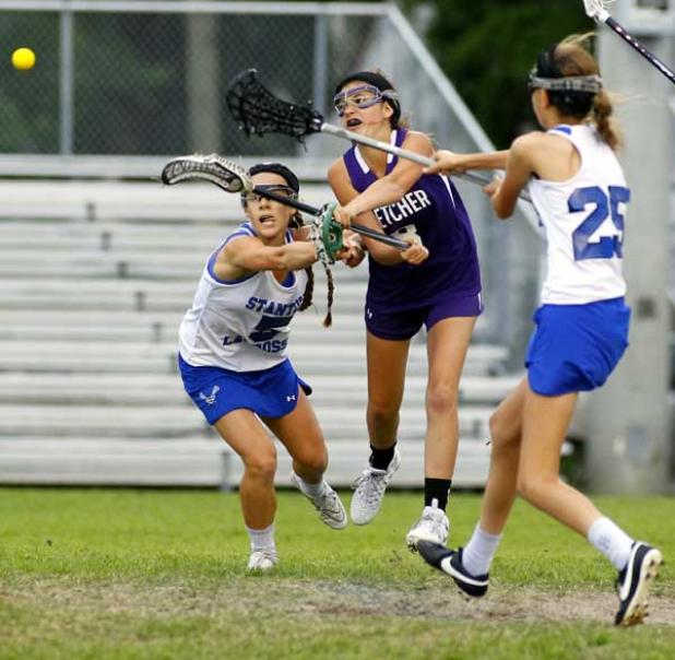 Fletcher High attacker Megan Davis scores the Senators’ second goal of the game in April 15's girls lacrosse first-round play-in game. Stanton Prep went on to a 16-7 victory. (photo by Rob DeAngelo)