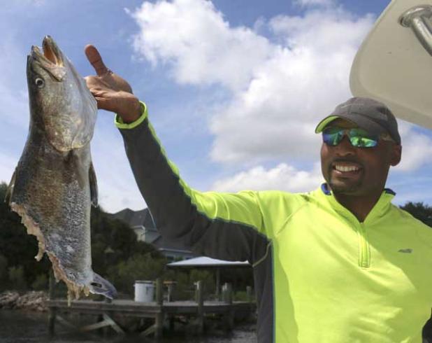 Donovin Darius with a monster spotted sea trout that was attacked by a shark.  Donovin was fishing in the St. Johns River with Capt. Steve Crowder. (photo submitted)