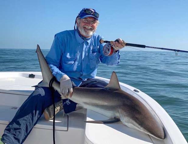 Charlie Smith holds a shark caught on a fly rod. (photo submitted)
