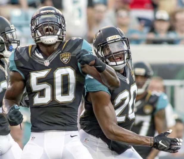 Jacksonville Jaguars defensive players Telvin Smith (50) and Jalen Ramsey (20) celebrate following a defensive play during the second preseason game of the season against the Tampa Bay Buccaneers at EverBank Field. (photo by David Rosenblum)