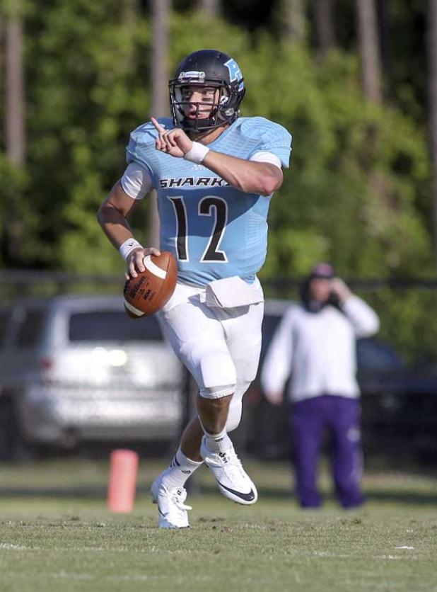 Ponte Vedra Sharks quarterback Nick Tronti looks for an open receiver during a spring game against Fletcher last month. Tronti recently committed to play college ball at UNC Charlotte. (photo by David Rosenblum)