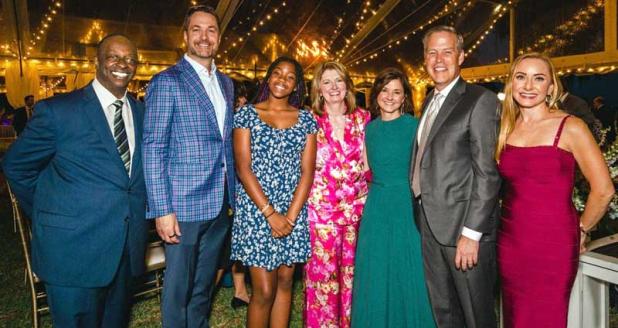 From Left: Darnell Smith, emcee; Kirk Larsen, event chair; Eliora, CAP student speaker; Kimberly Hyatt, president and CEO; Amy and Gary Norcross; and Kristine Cherek, event chair. (photo submitted)
