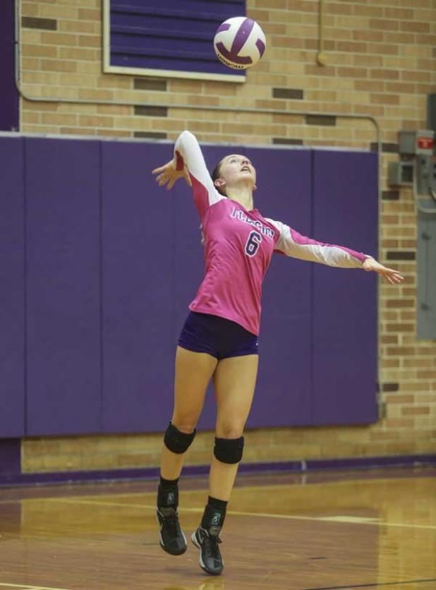Senators volleyball player Anna Gartner serves the ball during a recent game. (photo by David Rosenblum)