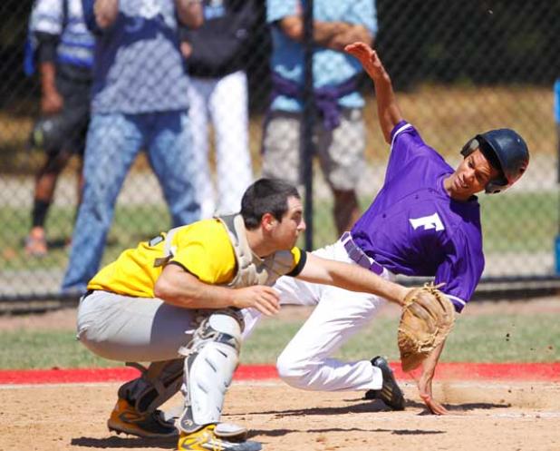 Fletcher High baserunner Ray Piper slides home ahead of the tag on a sixth-inning play at the plate against Englewood in the opening round of the spring break Dre Deleon Memorial baseball tournament at Parker High. Piper scored the Senators’ final run in a 6-2 victory. (photo by Rob DeAngelo)
