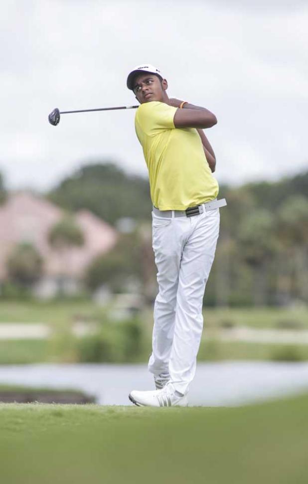 Junior Players champion Khavish Varadan hits a tee shot on the 8th hole during the final round. (photo by David Rosenblum)
