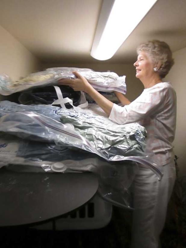 Carol Harding looks through the linens for Family Promise families. Ponte Vedra United Methodist Church is part of the program and provides a week of shelter for four homeless families. (photo by Eleanor Snite)