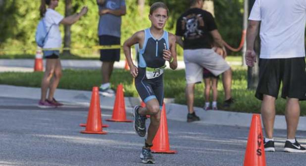Ava Galani navigates the running course during the BFAST Kids Triathlon in Nocatee. Galani won the Junior Girls 9-10 Division. (photo by David Rosenblum)