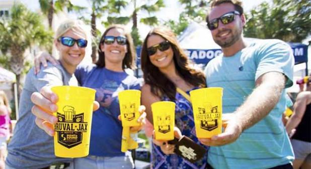 Attendees at last year’s festival show off their commemorative event cups bearing the 2015 Bruval Jax logo. (photo from facebook.com/bruvalbeerfest)