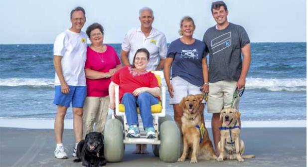 Retiring CCI service dog Madine (left) returned to Atlantic Beach recently to visit her trainers, Moody and Eugenia McCall (center). Madine was paired with Melanie Courtney (front) in 2007, and will now enjoy a life of leisure with Melanie and her parents (left). (photo submitted)