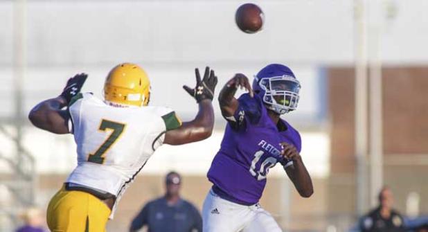 Fletcher quarterback Michael Young fires a pass against Ed White in the preseason classic. (photo by David Rosenblum)