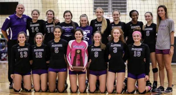 The Senators volleyball team poses with the district trophy after defeating Atlantic Coast 3-1 Oct. 20. (photo by David Rosenblum)