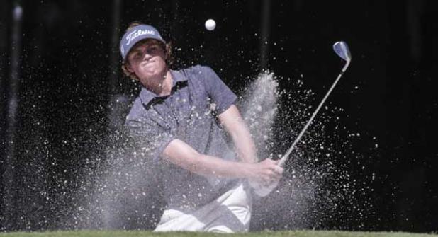 Ponte Vedra High School rising senior Spencer Slayden hits a shot out of a greenside bunker during the second round of the Jacksonville Amateur Golf Championships. Slayden would finish T6 in the event. (photo by David Rosenblum)