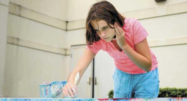 Gentry Groshell works on a painting. (photo submitted)