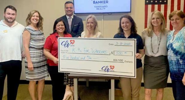 Shown are (front row) Realtors John Bayer and Paige Tyler, K9s Donor Relations Manager Megan Mosley, CBV Chair Cindey Nordman, K9s Donor Relations Manager Lindsay Grayson, Realtors Carole Bayer and Nancy Hammond, and (in back) Realtor Ranson Combs. (photo submitted)