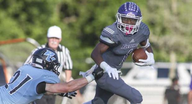 Fletcher Senators running back Anthony Evelyn runs past Ponte Vedra Sharks free safety Andrew O’Dare during the spring game in May. (photo by David Rosenblum)